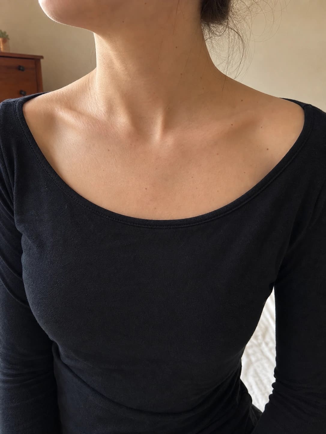 The same collarbone indoors, before any ink